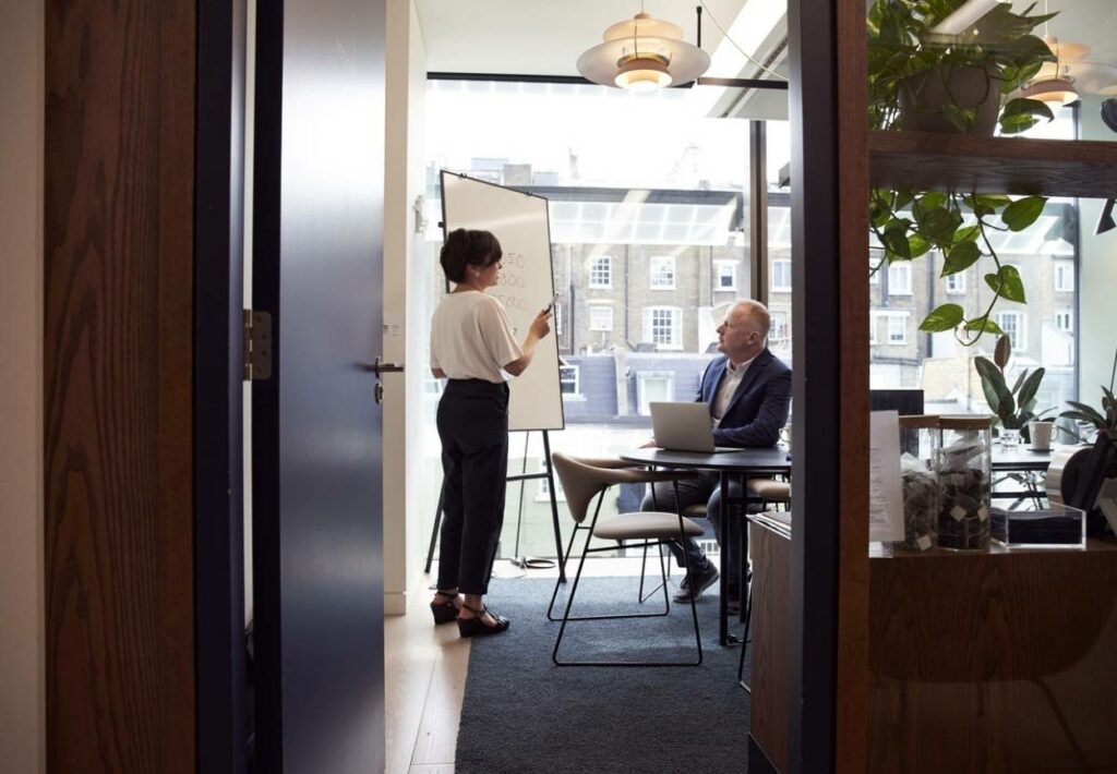 CEO And Employee Discussing Things in CEOs Office