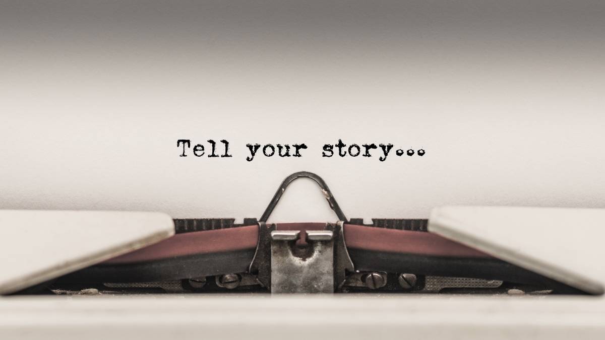 Typewriter typing "Tell Your Story"
